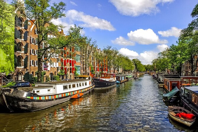 Amsterdam Day Trip from Brussels With Cheese, Clogs and Windmills - De Gooyer Windmill: a short stop that teaches you how Dutch mills work