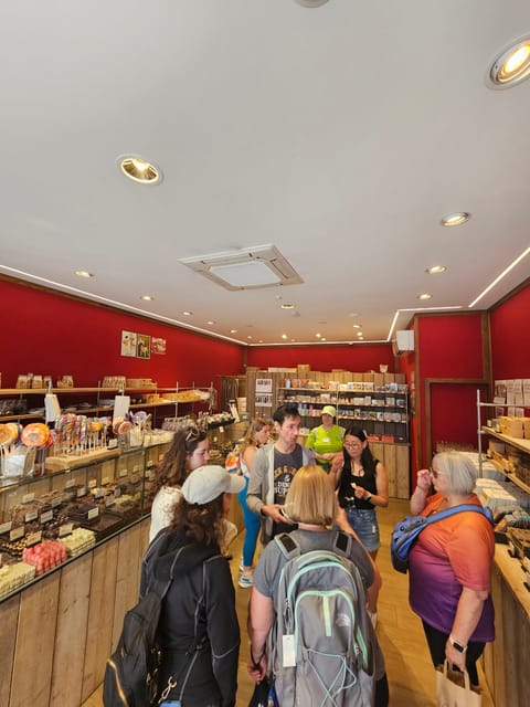 Bruges: Walking Tour with Hot Chocolate & Chocolate Tasting - Three chocolate shop stops: pralines, variety, and how to pace tastings