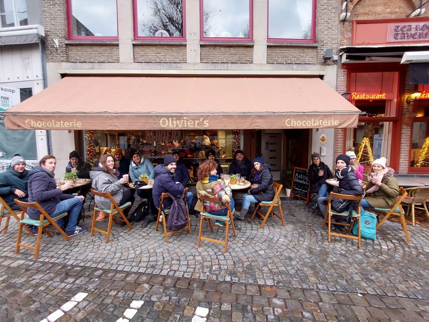 Bruges: Walking Tour with Hot Chocolate & Chocolate Tasting - Meet at FNAC, spot the neon guide, and get walking fast